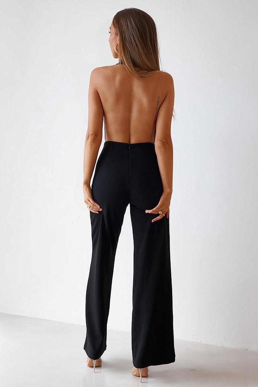 http://www.shopjaus.com/cdn/shop/files/backless-jumpsuit-black-jaus-1.jpg?v=1687892690